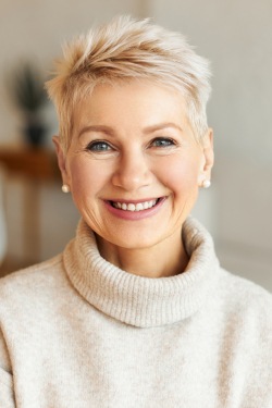 woman wearing sweater smiling